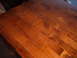 1988 Ford Bronco - Wooden tabletop recently refinished, showing wood grain and a glossy finish.