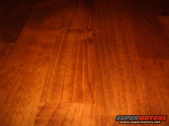 Wood grain texture with SUPERMOTORS.NET watermark