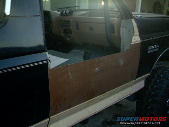 1989 Ford Bronco interior showing dashboard and door panel removed for work