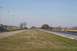 1997 Mercury Grand Marquis - A drag strip scene with cars visible on the track under a clear sky.