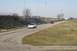 1997 Mercury Grand Marquis - A white 1997 Mercury Grand Marquis is seen on a track with another vehicle in the distance.
