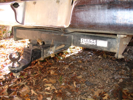 Rear bumper with Reese trailer hitch and ball mount, locked