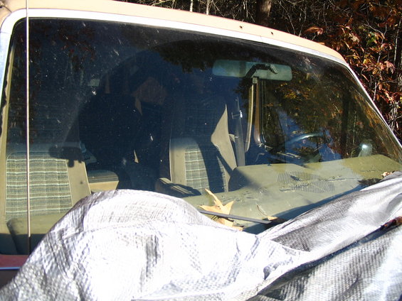 1984 Ford Bronco interior with plaid seats and dashboard
