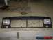 1995 Jeep YJ - This is a front grille assembly for a Jeep Cherokee XJ, including the headlights.