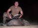 2005 BMW 3 Series - A hunter proudly displays his javelina catch, taken with a bow and arrow.