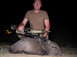2005 BMW 3 Series - Hunter poses with a javelina after a successful hunt at night.
