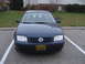 2002 Volkswagen Jetta - Front view of a dark blue 2002 Volkswagen Jetta, parked in a lot with a dealership license plate.