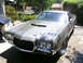 1972 Ford Ranchero - Front view of a 1972 Ford Ranchero with a prominent grille and hood scoops.