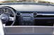 2006 Mazda Miata - The dashboard and steering wheel of a car are visible, with the Mazda logo on the steering wheel.