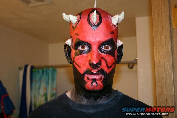 Person with Darth Maul makeup on face and head, wearing a black t-shirt