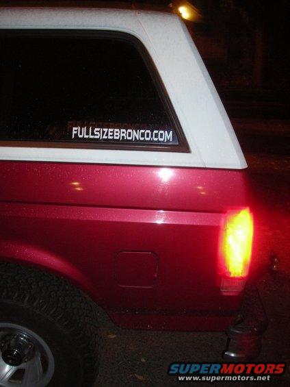 Red and white SUV rear quarter panel with a sticker reading FULLSIZEBRONCO.COM