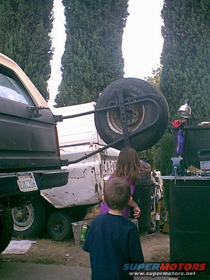 mo-2.jpg here is Monica and Christian doing the "Limbo" under the spare tire.