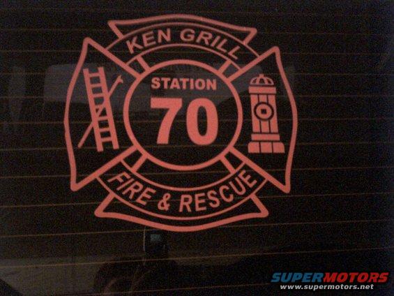 Red fire department decal with 'KEN GRILL STATION 70 FIRE & RESCUE' text and graphics