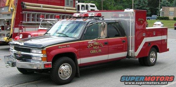 Red and black crew cab truck with service body, Squad 70 markings