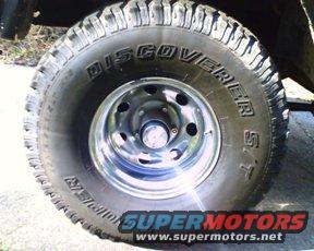 Close-up of a Discoverer ST tire on a chrome wheel with Supermotors.net logo