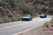 2006 Mazda RX-8 - Two cars travel along a desert highway, with a Mazda RX-8 in the foreground.