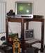 2006 Ford E350 - A collection of electronic devices, including televisions and a computer, are arranged on a rustic wooden table.