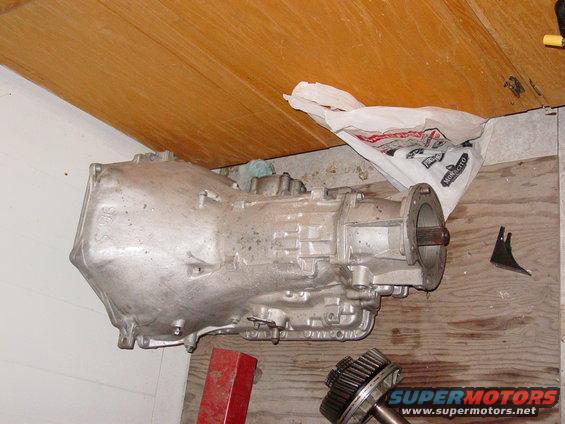 Aluminum transmission casing with visible casting marks and a flange on the right