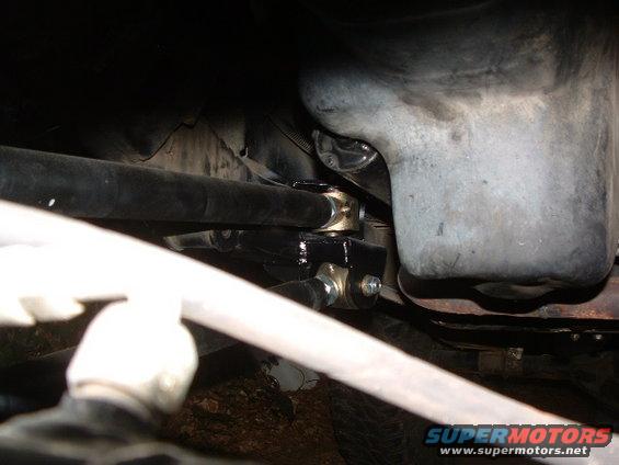 Close-up of steering linkage with gold and black components
