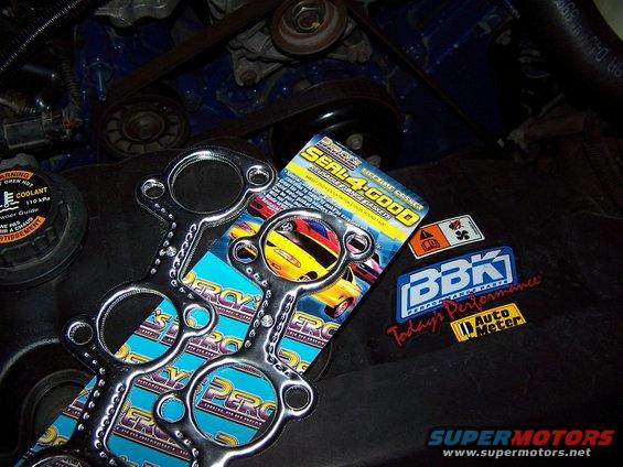 Exhaust gaskets and performance stickers on engine cover