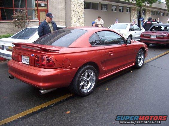 Red coupe rear 3/4 view. 1994 Ford Mustang