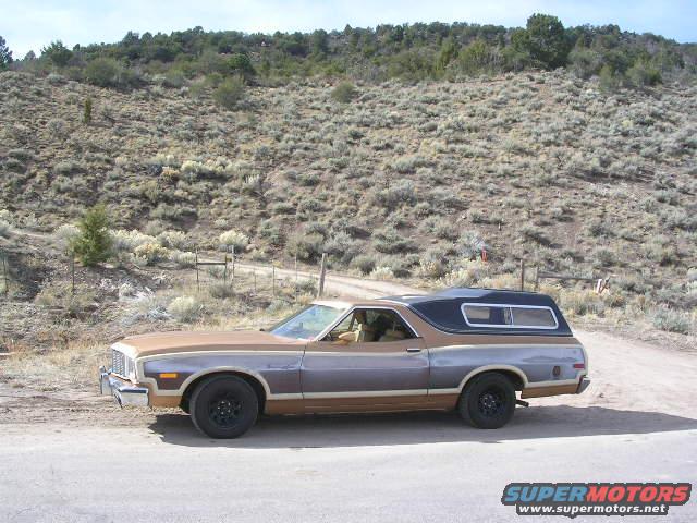Brown and grey 1975 Ford Ranchero side view with black camper shell