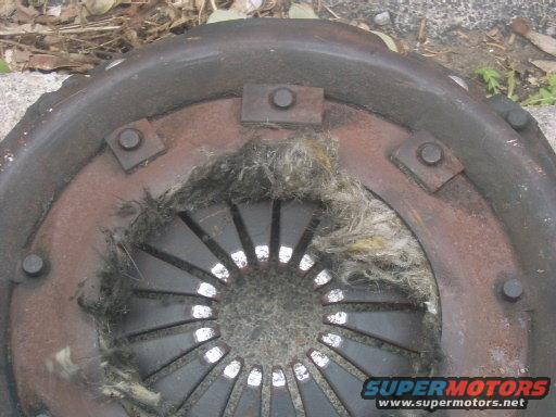 Damaged clutch disc with frayed material visible
