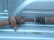 1994 Jeep YJ - A rusty driveshaft with a U-joint and a rubber boot is visible.