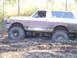 1989 Ford Bronco - This 1989 Ford Bronco is stuck deep in the mud, showing its side profile.