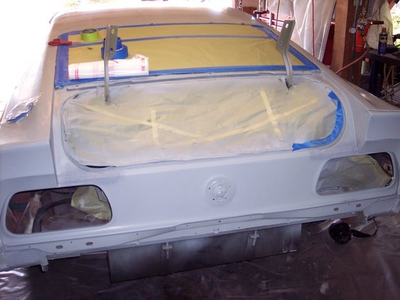 1971 Ford Mustang rear end, masked and primed for paint. Trunk lid is open