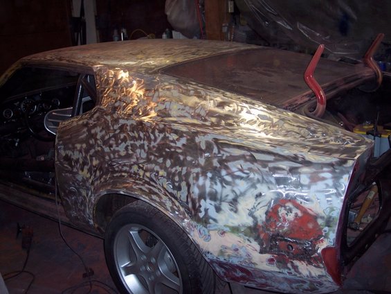 1971 Ford Mustang body in primer, rear three-quarter view