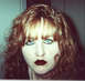 1970 Mercury Cougar - A close-up portrait of a woman with striking makeup and distinctive hairstyle.