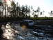 1989 Ford Bronco - SUV struggling through a muddy track in a wooded area.