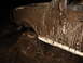 1989 Ford Bronco - This 1989 Ford Bronco is heavily covered in mud, obscuring much of its bodywork but revealing its off-road capabilities.