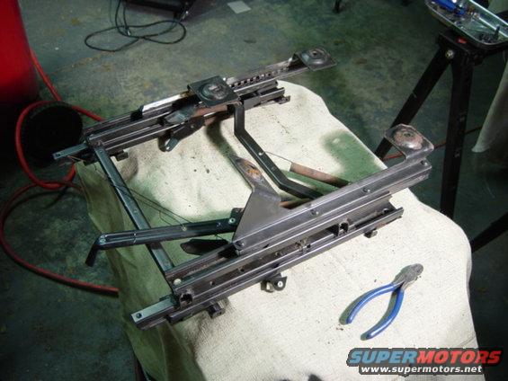 dsc00551.jpg More careful measuring, cutting, and filing will get the forward leg in the right place, too.  There's not enough room in the truck floorpan for the leg to sit on the downward slope, so it had to be moved back several inches to rest flat on the floorpan.