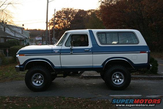 Side view of a 1978 Ford Bronco with white and blue paint