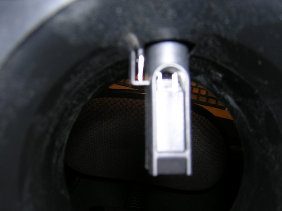 Close-up of a silver and white MAF sensor inside a black housing