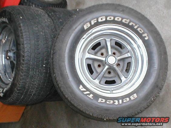 Stack of BFGoodrich Radial T/A tires on chrome five-spoke wheels