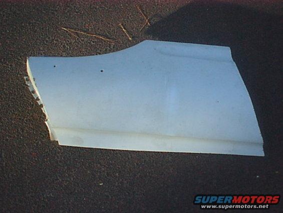 White curved fender or quarter panel skin on pavement