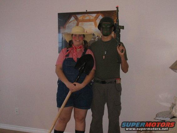 People in Halloween costumes: farmer with shovel and soldier with rifle