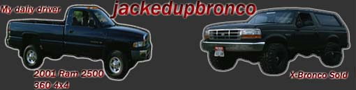 Black 2001 Ram 2500 pickup truck next to a black Ford Bronco