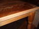 1988 Ford Bronco - Close-up of a wooden table's surface, revealing wear and tear.