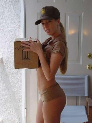 Woman in UPS uniform holding a package, standing by a door