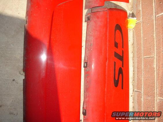 Red car fender or door panel with black "GTS" text