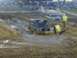 1989 GMC Jimmy - An SUV struggles in a muddy race, with spectators visible in the background.