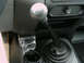 1997 Ford F-150 - Close-up of a manual transmission shifter and ashtray in a truck's interior.