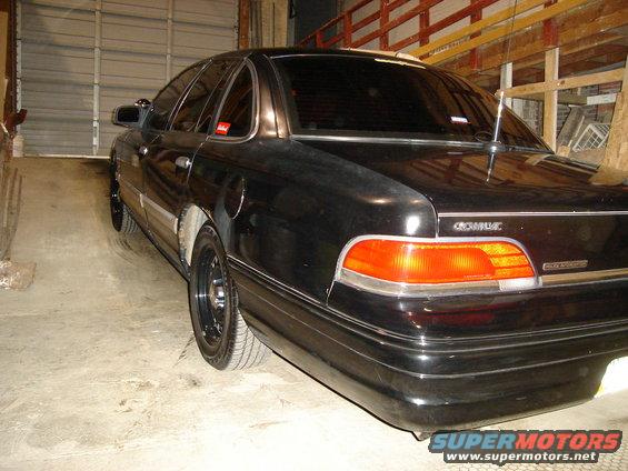 Black 1992 Ford Crown Victoria parked inside