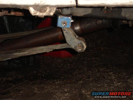 close-up of a vehicle's leaf spring and shock mount