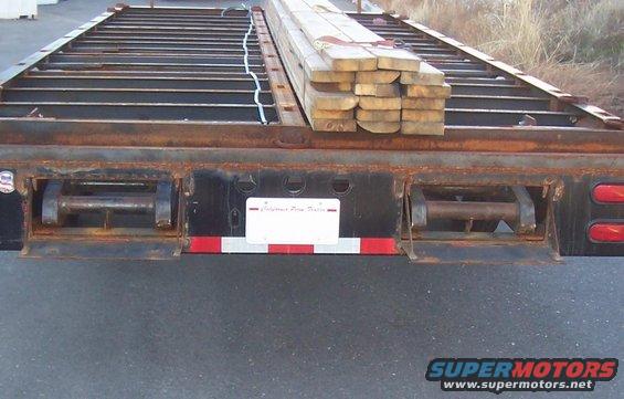 both ramps stored in rear of trailer, under deck.
The big 10" I-beam frame hides the ramps completly when there stored under here