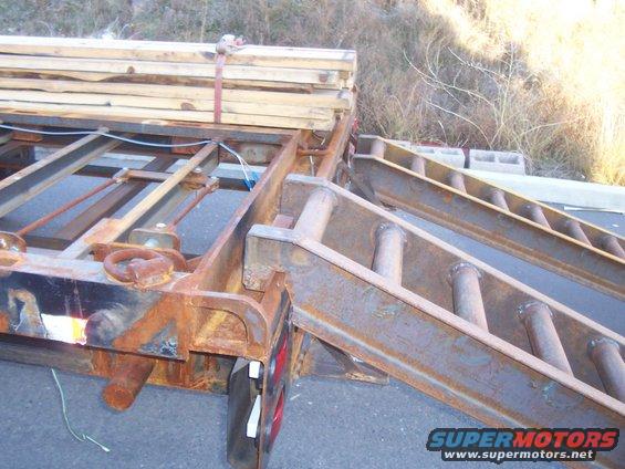 ramp hooked on to rear ramp rail of trailer. This rail will allow the ramps to be hooked on to any position on the rear of the trailer. Making loading vehicles with all different track width easy, including ATV's
The hook on the ramps will need to be opened up an extra 1/2" to fit on to this larger rail